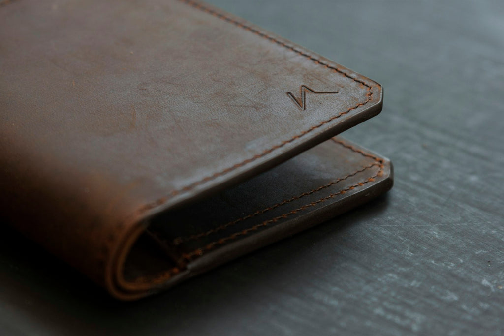Brown leather bifold wallet corner detail