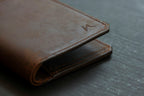 Brown leather bifold wallet corner detail