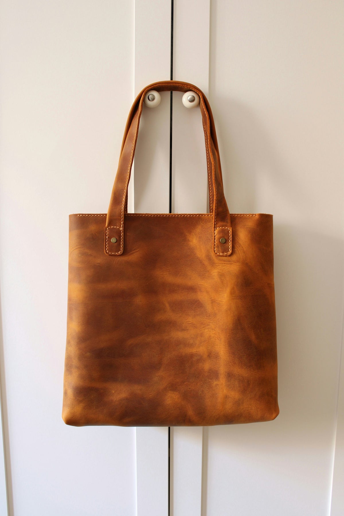 Leather tote bags in assorted tan tones