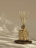 Reed diffuser in glass bottle