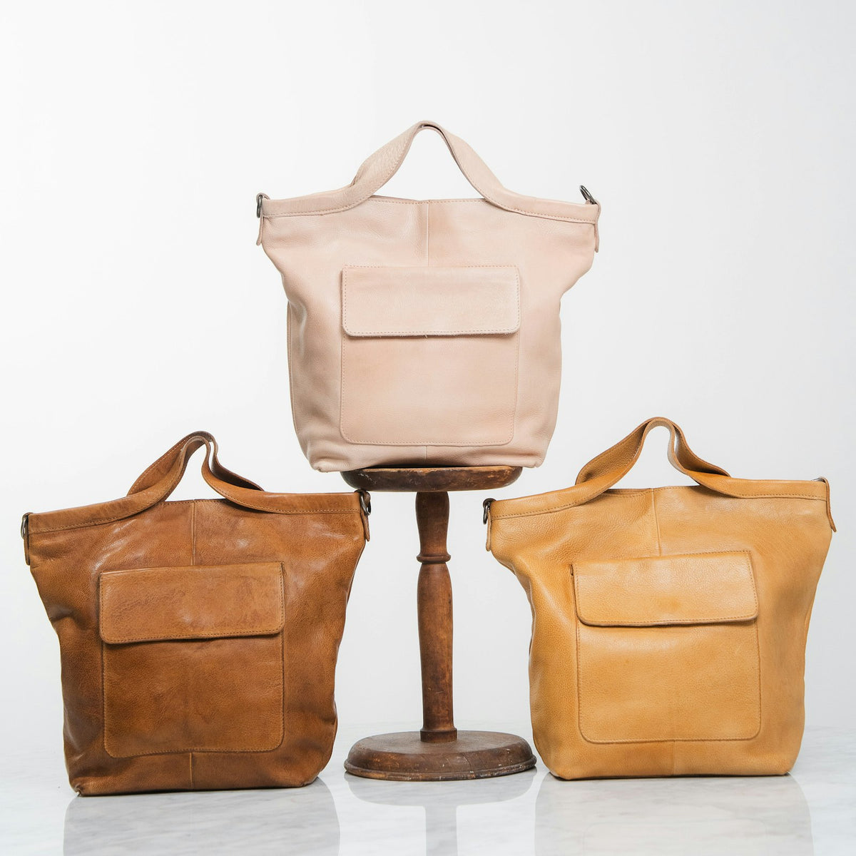 Leather tote bags in assorted tan tones